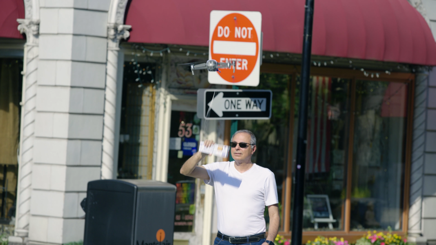 Man grabbing a box of Bahlsen leibniz from a drone