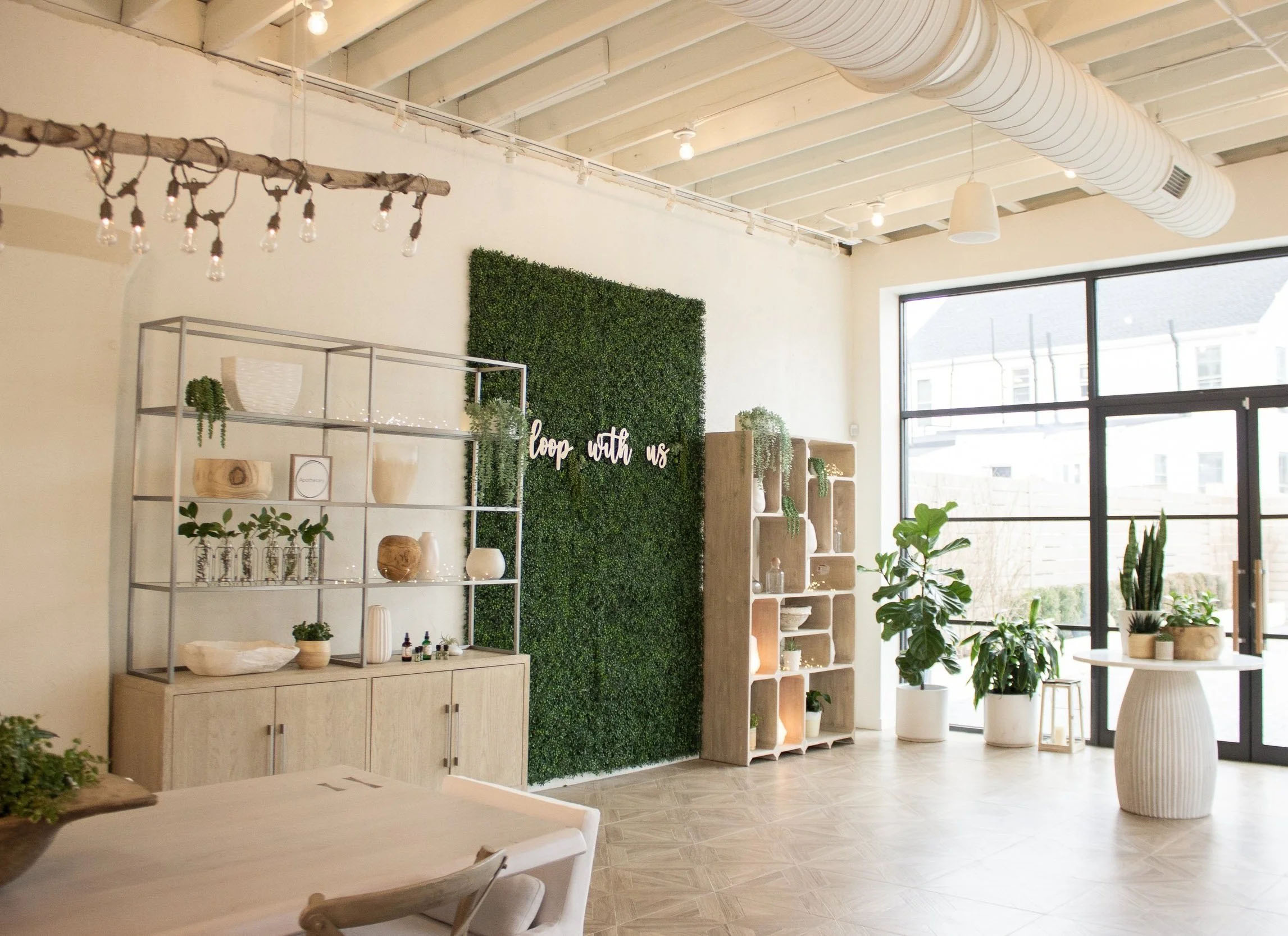 Apothecary area at Loopwell with various plant decor and holistic products